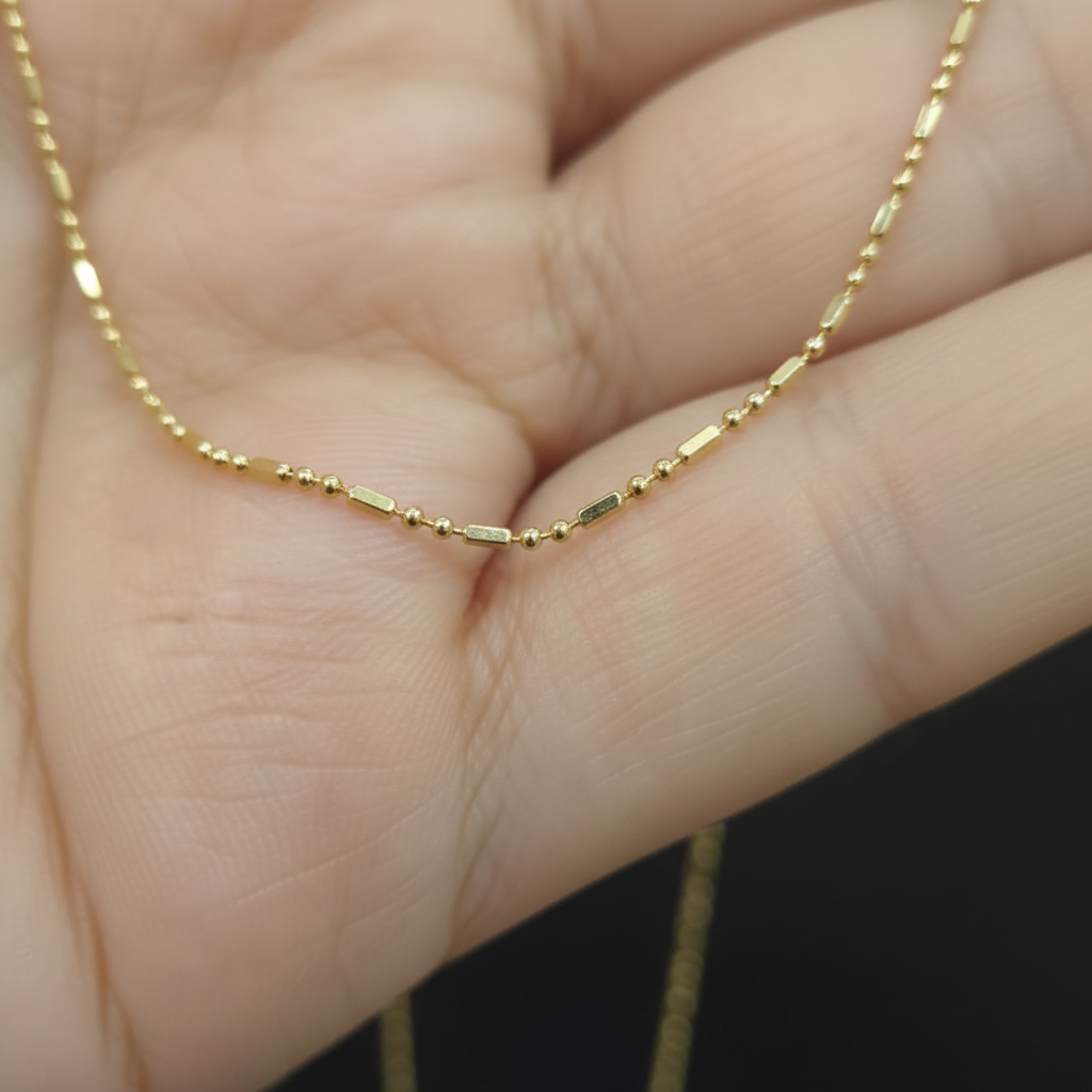 Cadena bolita barra oro 18k dama - detalle macro del tejido
