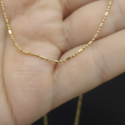 Cadena bolita barra oro 18k dama - detalle macro del tejido