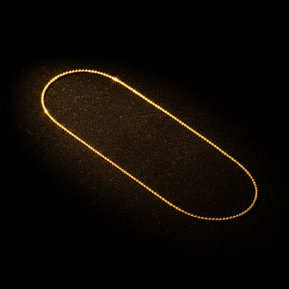 Cadena Bola Oro 18K Dama fondo negro editorial